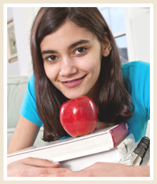 Student with books and an apple